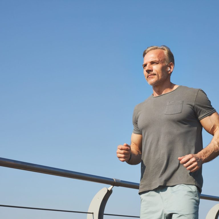 view-content-active-mature-man-gray-tshirt-bending-arms-running-outdoors (1)